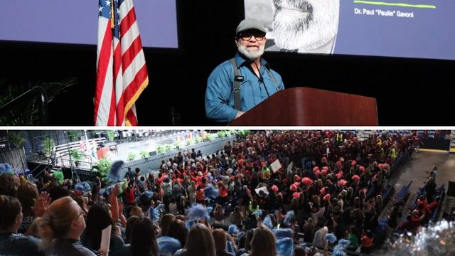 Video thumbnail: Dr. Gavoni at a lectern beside a U.S. flag, above a wide view of a packed arena audience