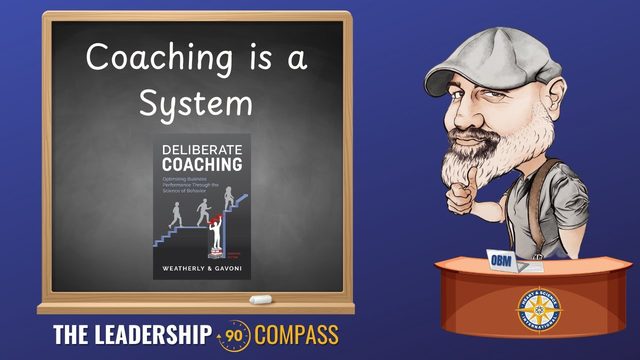 Video thumbnail: a chalkboard reading Coaching is a System with the business edition of Deliberate Coaching, beside an illustration of Dr. Gavoni
